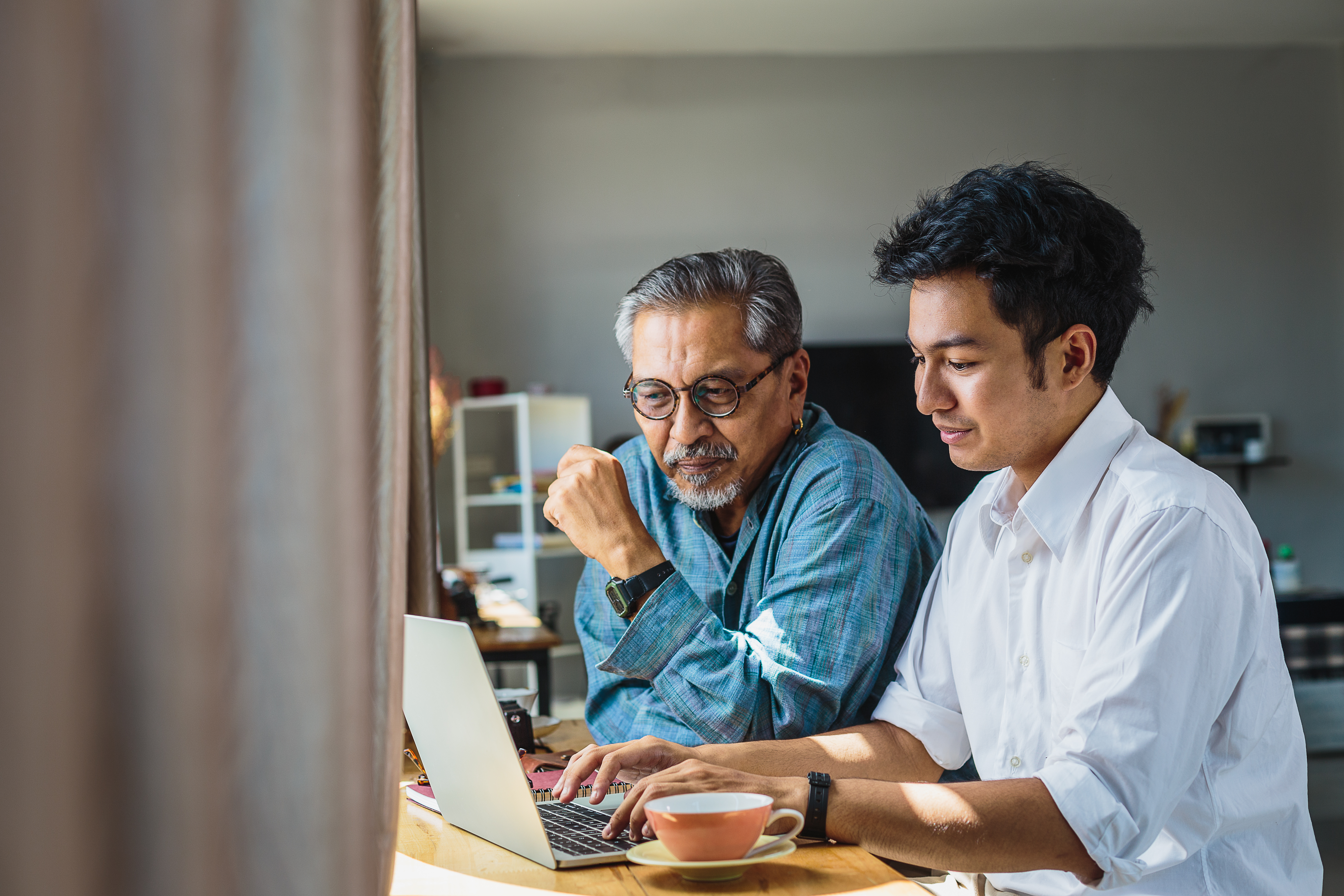 Student and parent sitting at computer.