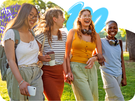 Four friends walking outside.