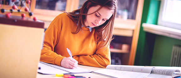 Female student taking notes