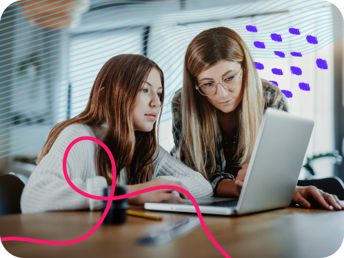 Two students looking at computer