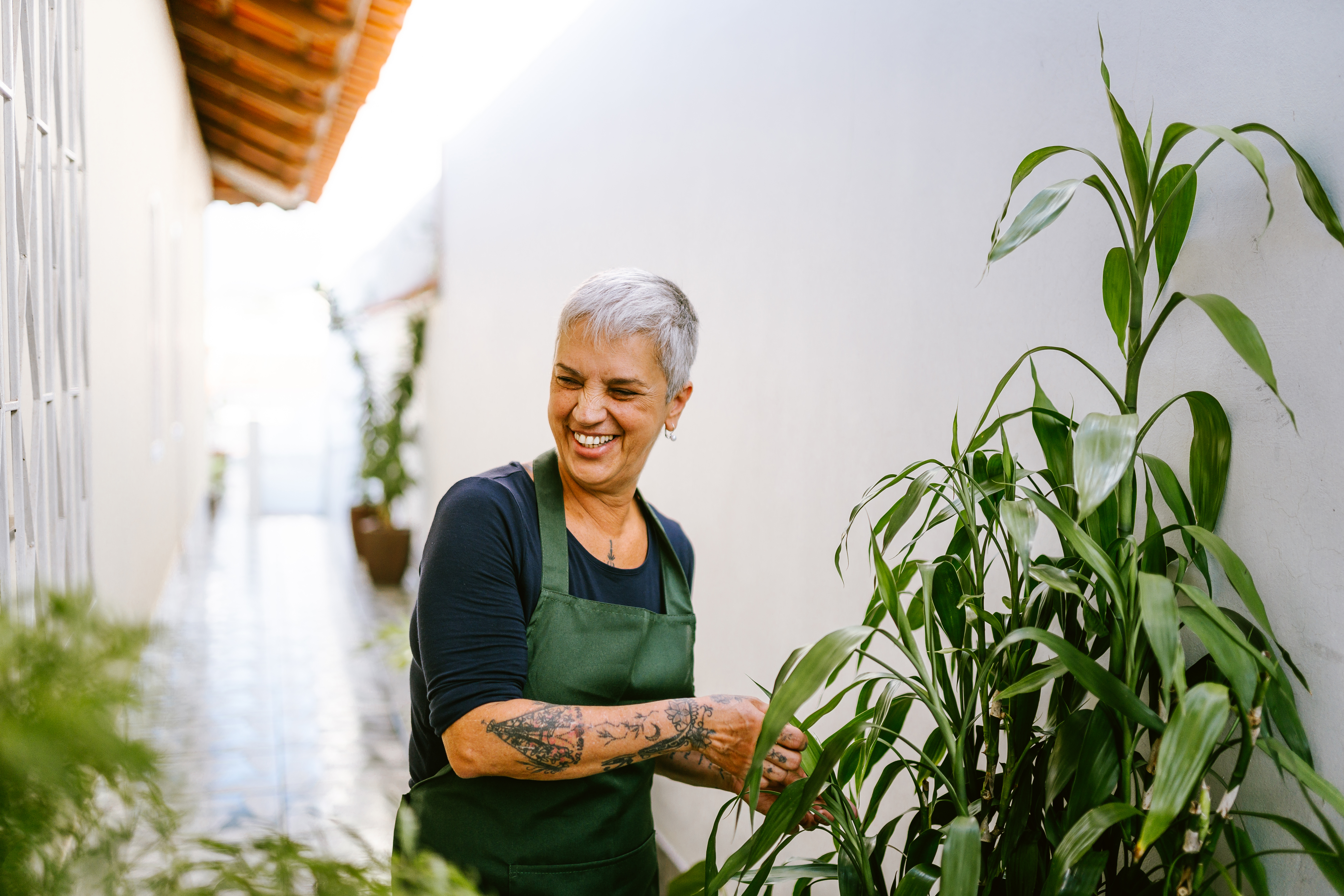 Person gardening and smiling.