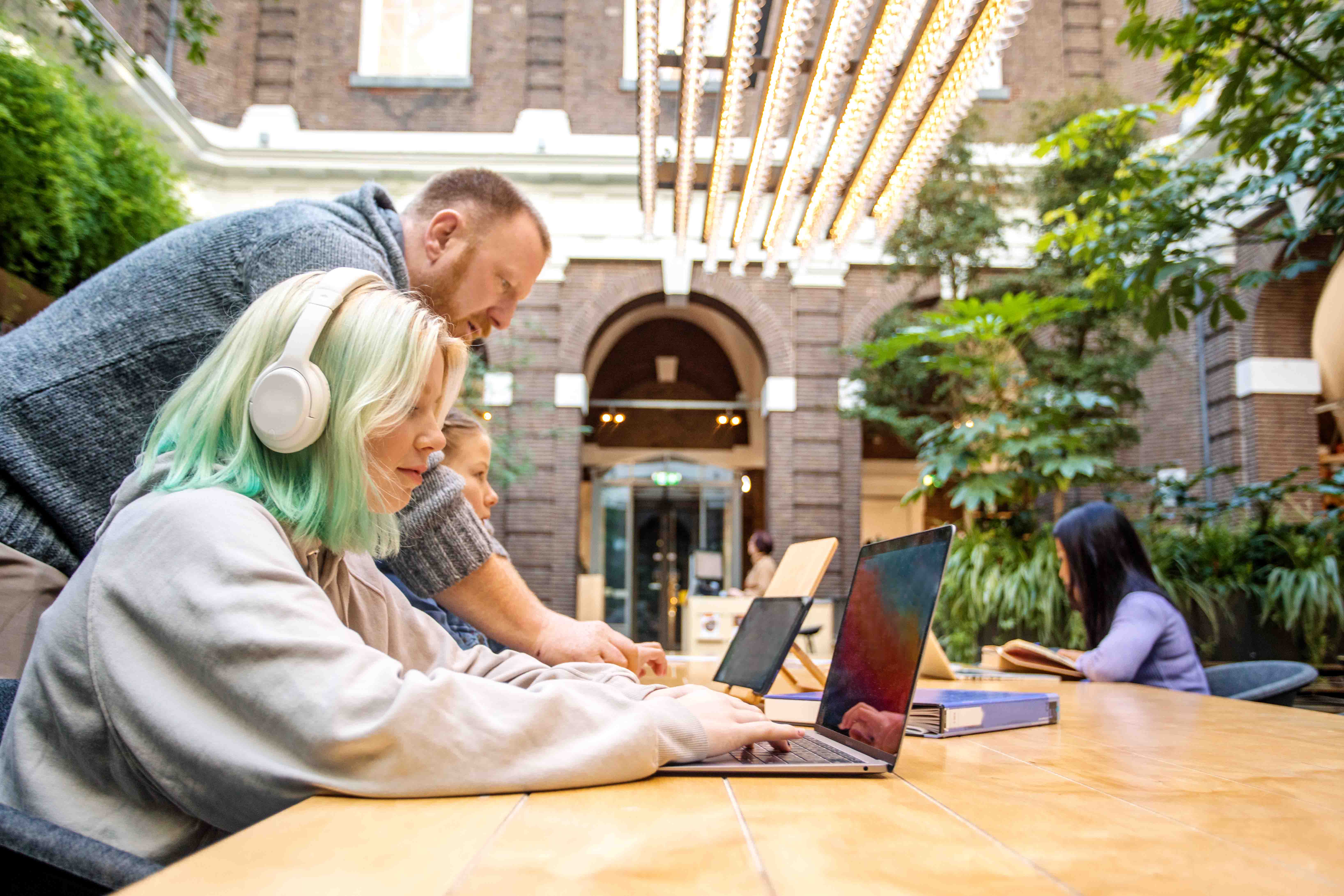 student_learning_on_computer_outside