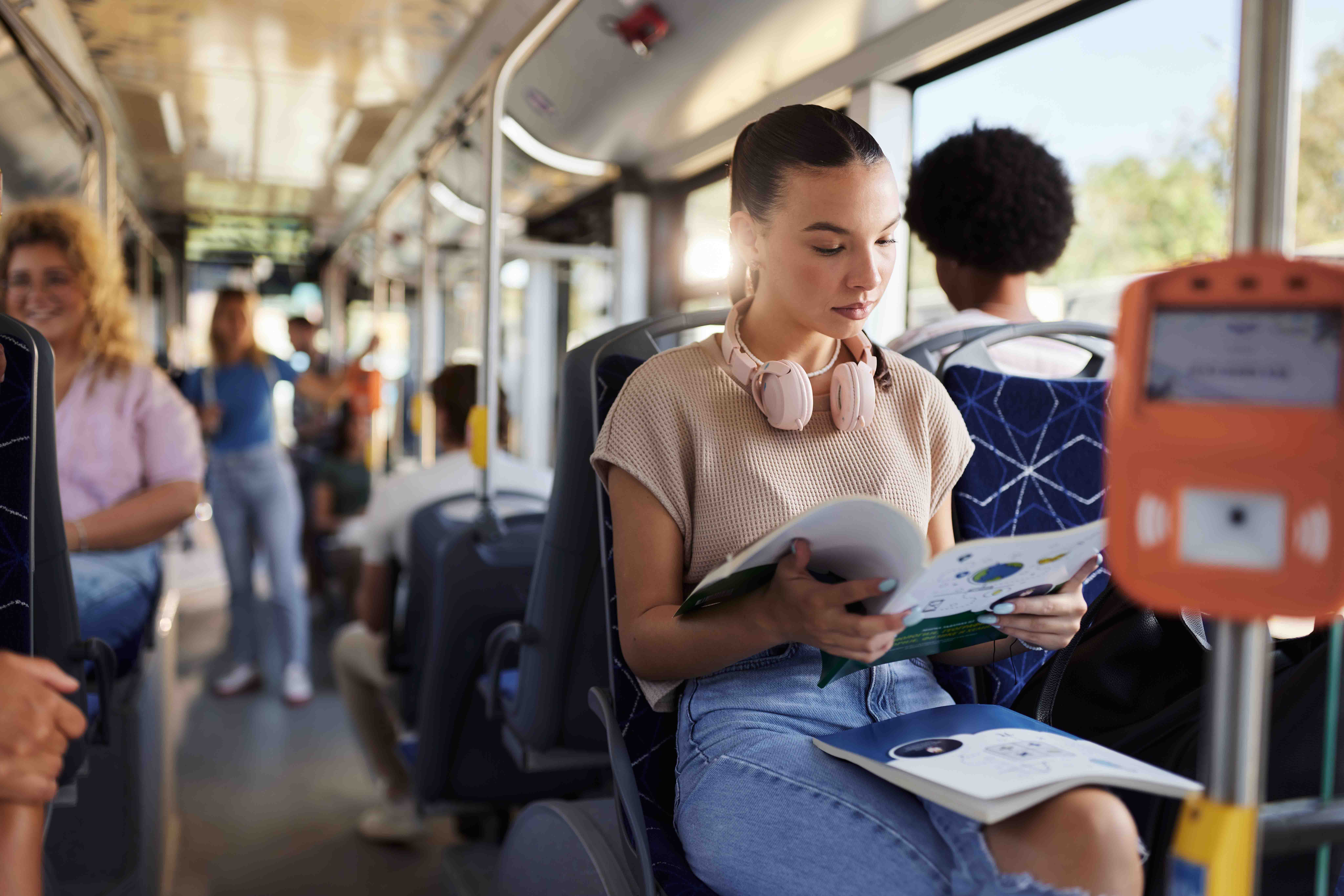 Student reading on bus.