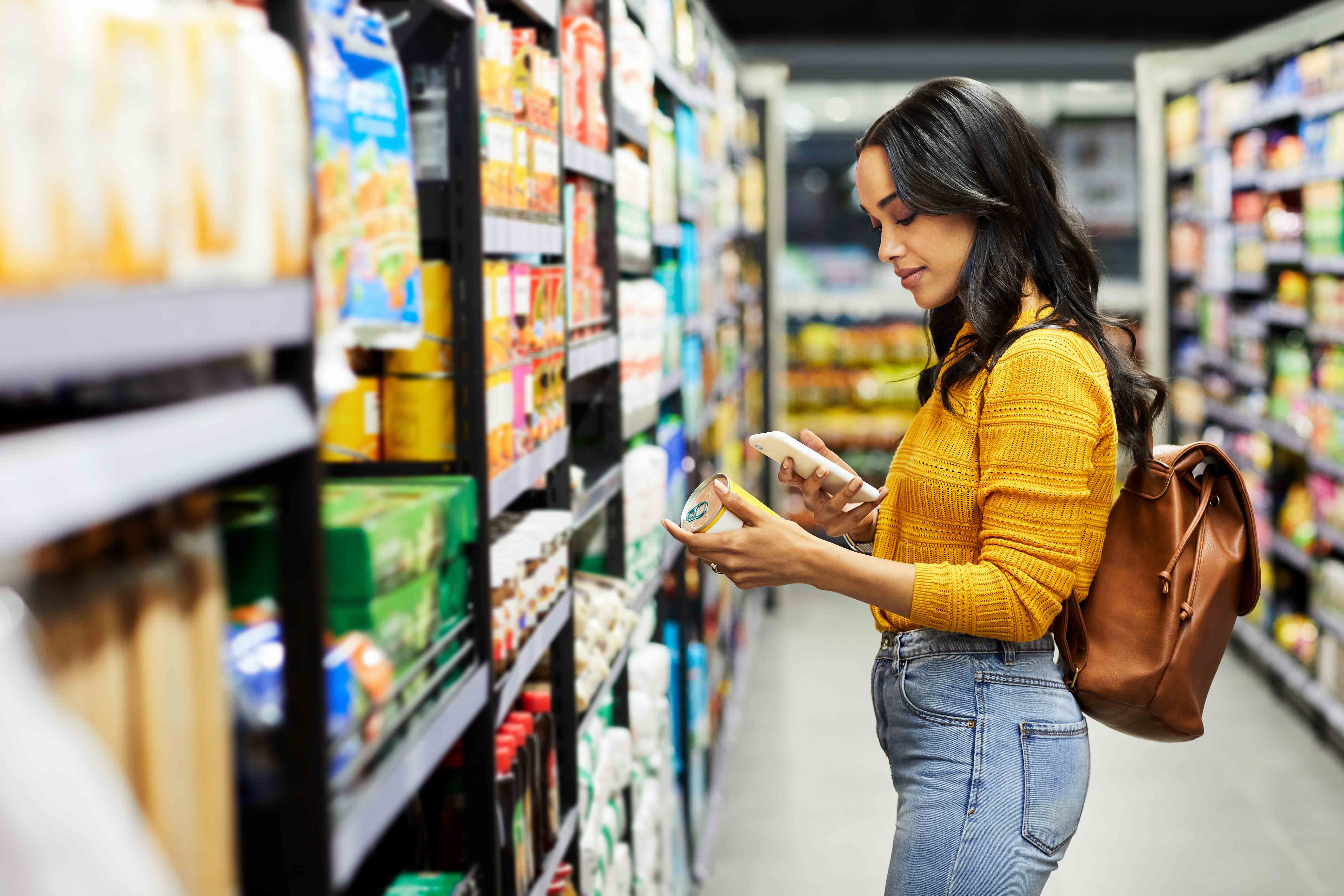 Young adult looking at product in store.