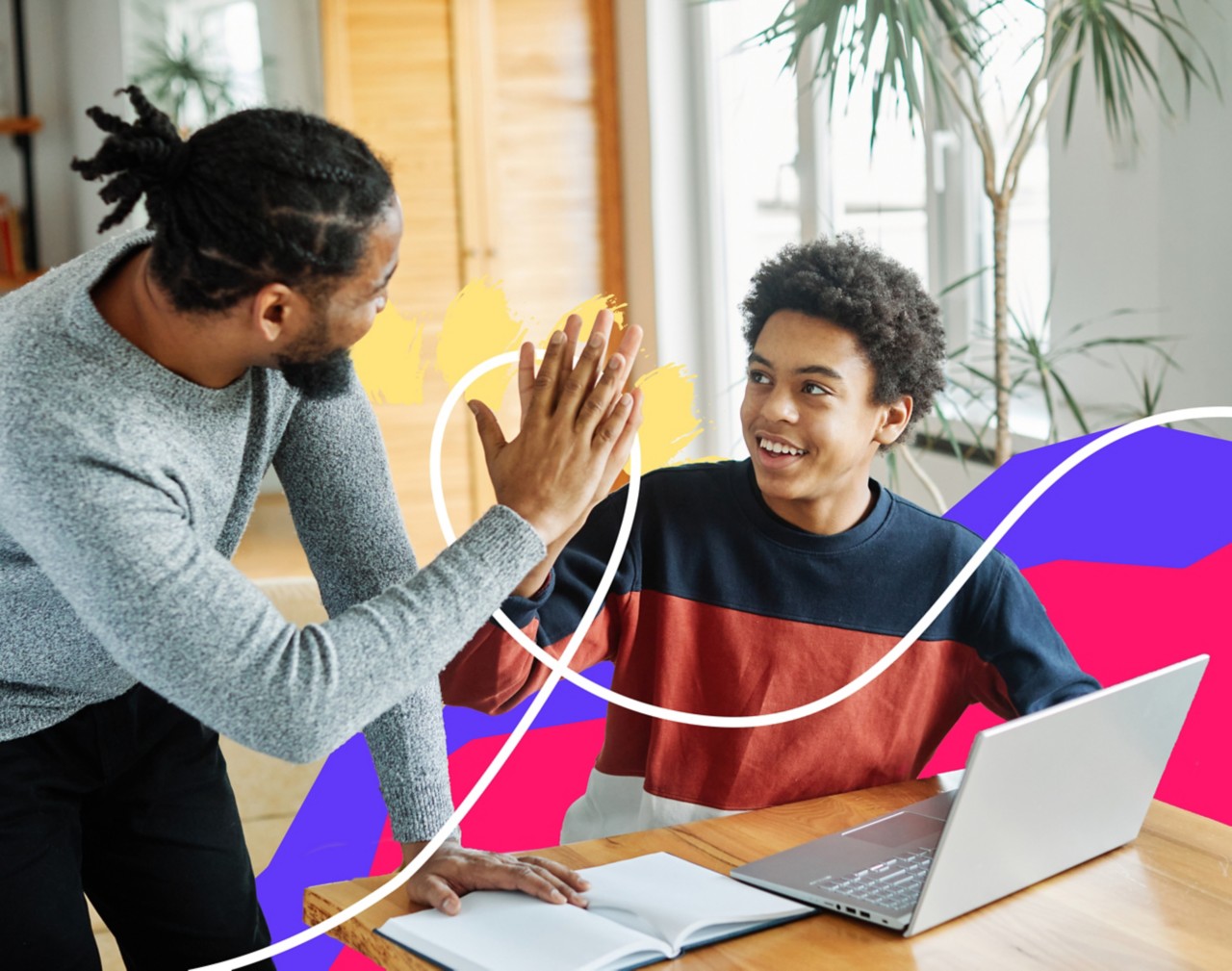 Student and parent high-fiving