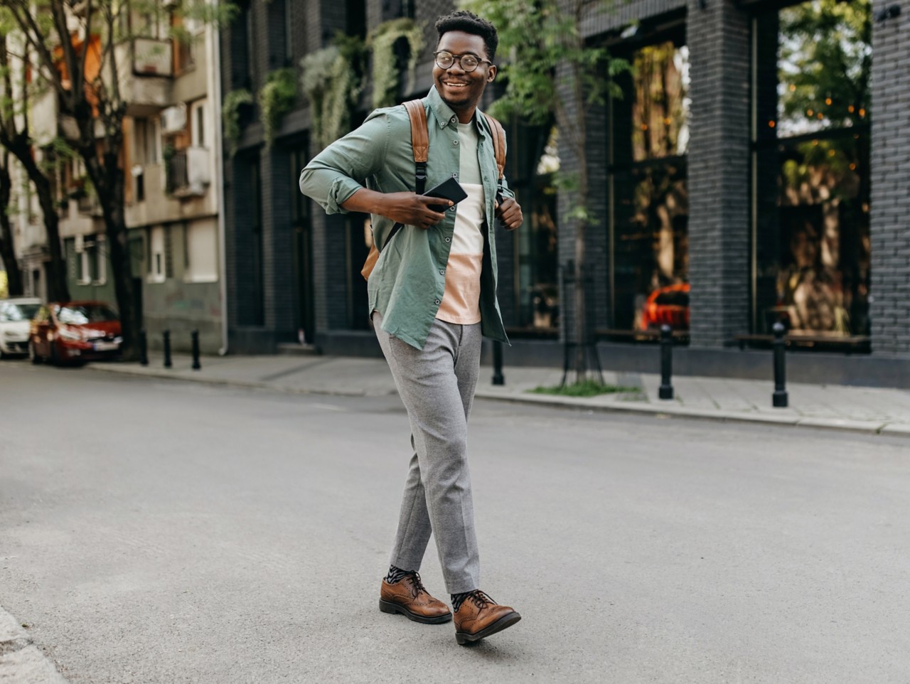 Person walking down city center street.